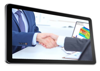 tablet screen showing people shaking hands