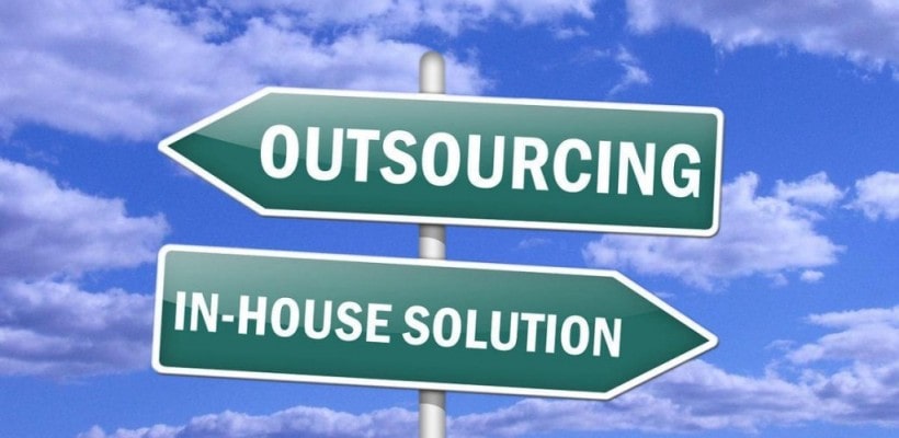 signs saying outsourcing and in house solution
